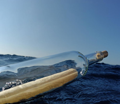 we-and-sardinia-bottle-containing-message-floating-in-sea-sami-sarkis
